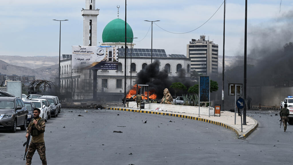Syrian soldier killed and at least 18 people wounded by Damascus car bomb