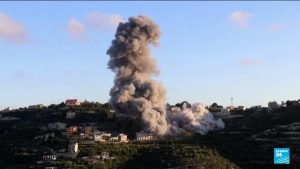 Israel strikes Lebanese village and calls up more troops in the region